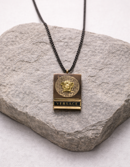 black chain with gold square pendent