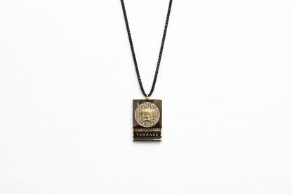 black chain with gold square pendent